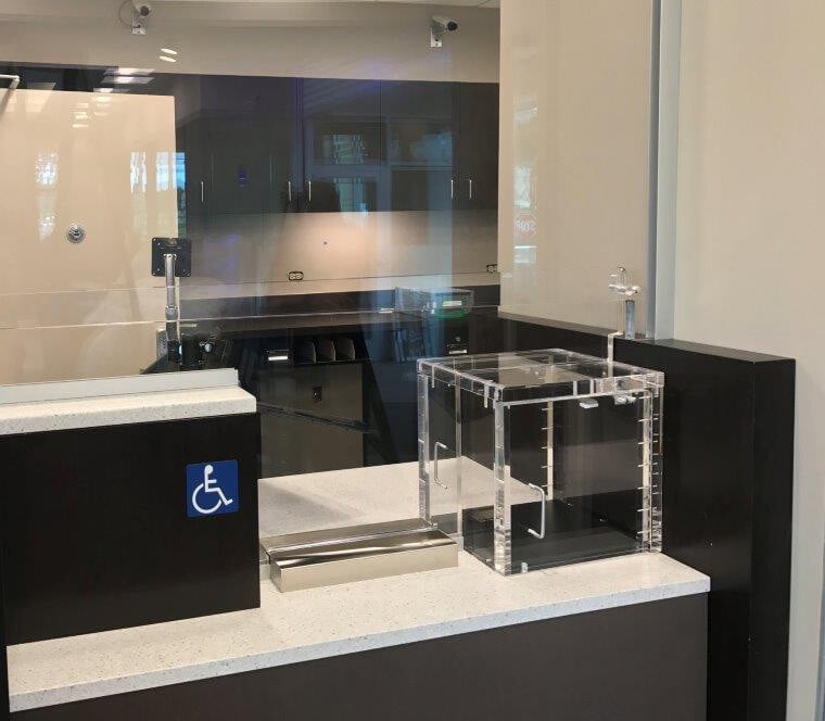 A photo displaying a bulletproof package passer, which is available in a range of options from Total Security Solutions