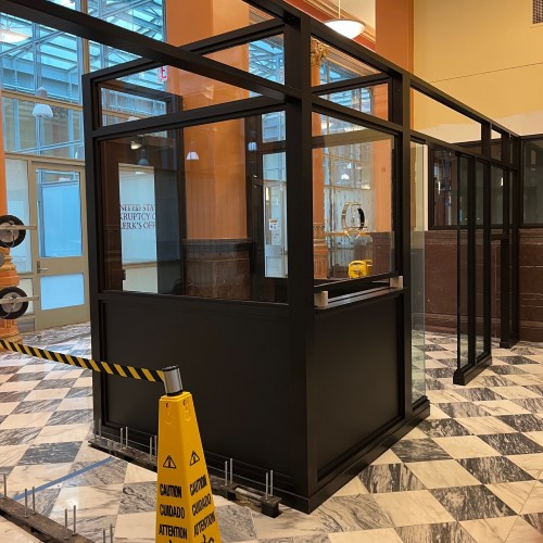 An example of a security booth integrated into a municipal building that helps keep security personnel and other employees safe from potential threats