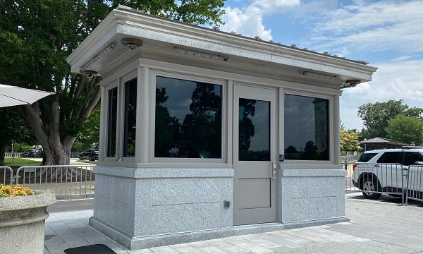 A freestanding bulletproof guard booth from Total Security Solutions