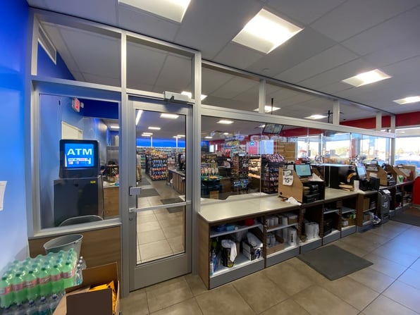 A convenience store with bullet-resistant glass, a growing trend in the retail industry.