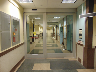 A hospital is one example of a building where the fire test response standard ASTM E119 is used to verify predetermined test exposure under an applied load