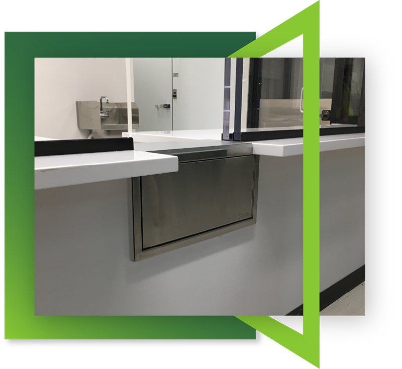 A high-quality bulletproof transaction drawer installed in a building by Total Security Solutions