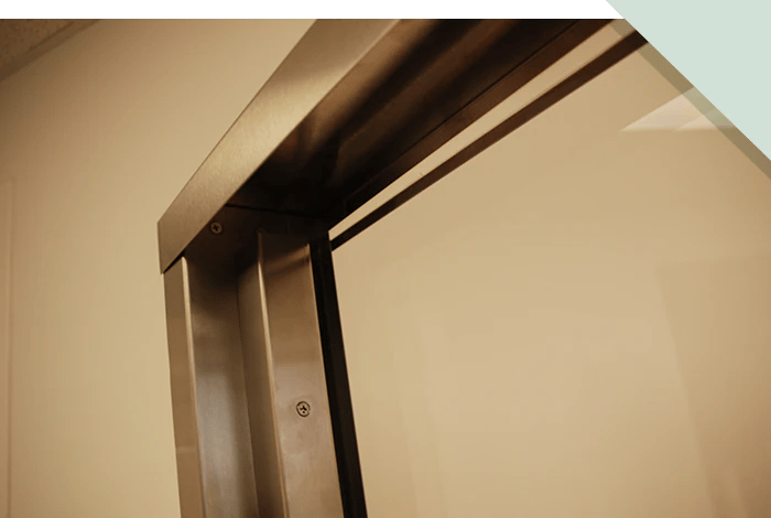 A closeup photo of stainless steel framing as part of a system for ballistic protection A closeup photo of stainless steel framing as part of a system for ballistic protection