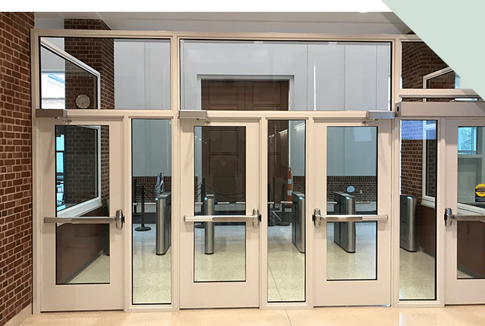 An example of a security vestibule entry that functions as a secure entrance hall that works alongside existing security systems and protocols